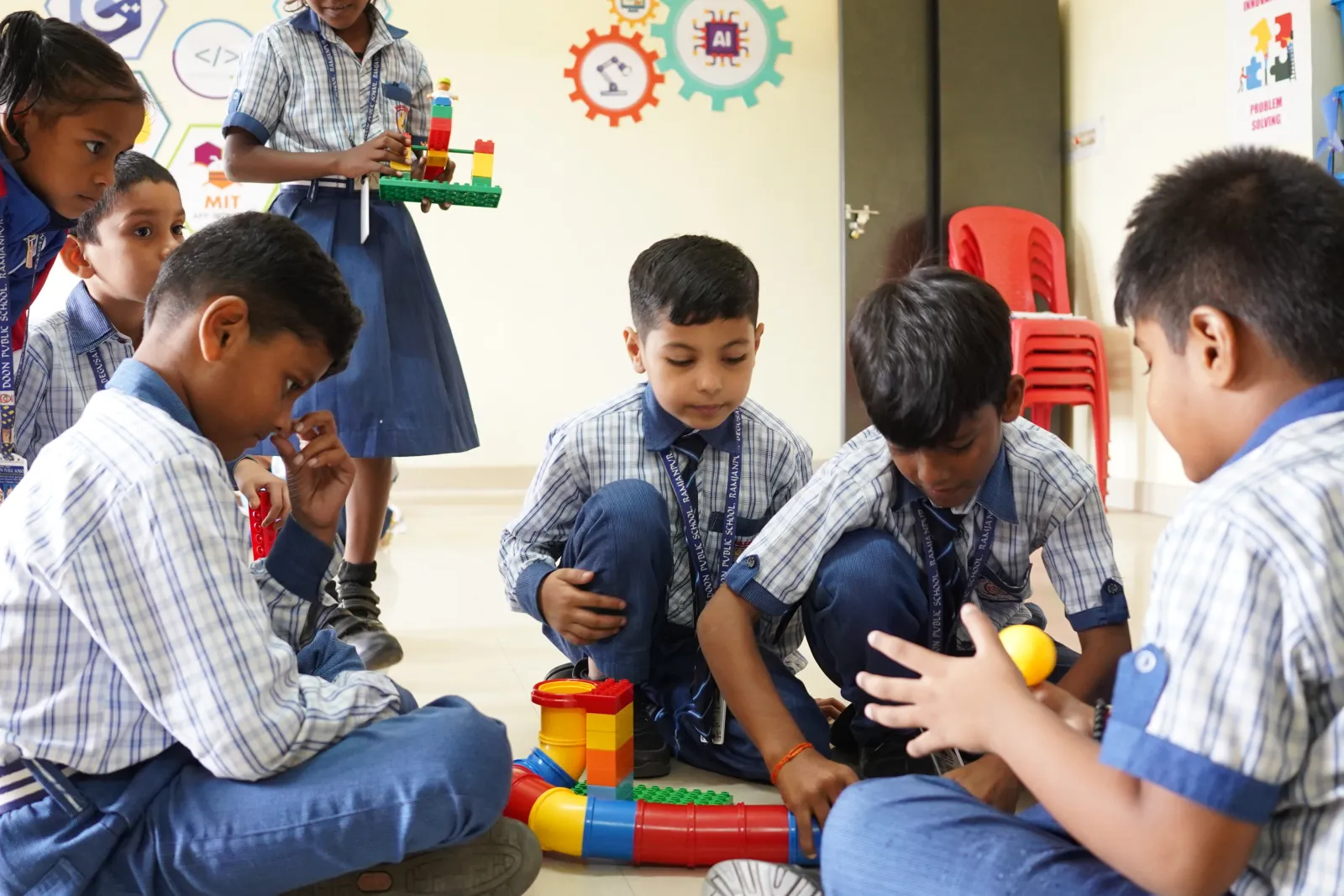 Young students building with blocks in the AI and robotics lab